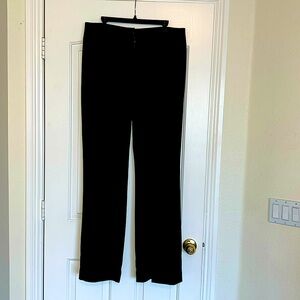 Women’s trousers with 3 button, 1 inside button, zipper front.